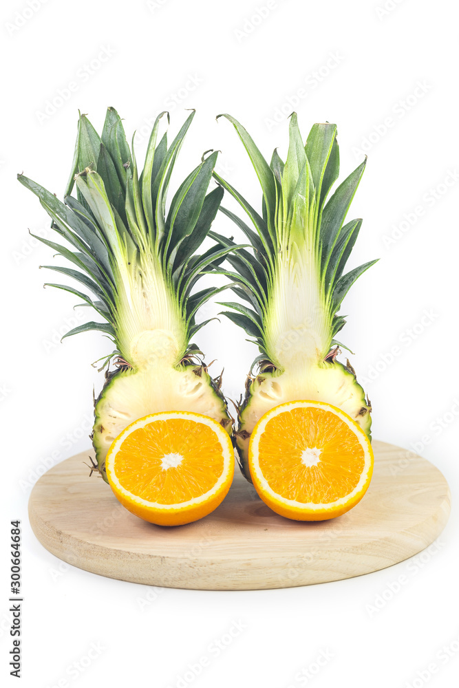 slices of pineapple and slices of orange on white background slices of pineapple and slices of orange on white background