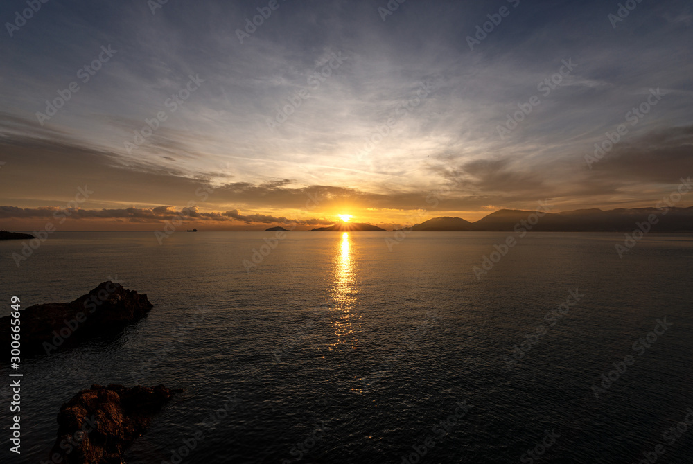 Sunset in the Gulf of La Spezia with the Palmaria, Tino and Tinetto islands. Liguria, Italy, Europe Sunset in the Gulf of La Spezia with the Palmaria, Tino and Tinetto islands. Liguria, Italy, Europe