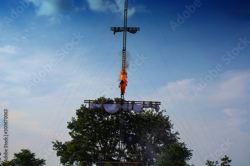 Stuntman jumping in flames from a mast photo