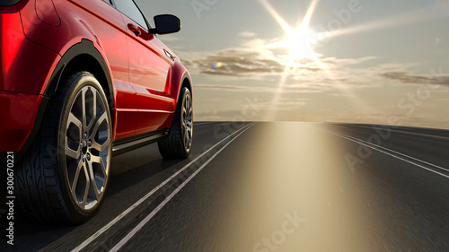 3d car sedan rides on the road to meet the sun, 3D rendering. Wheel close-up. photo