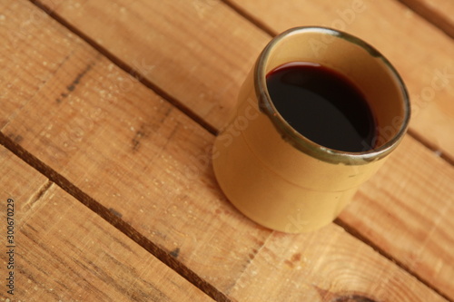 earthenware glass filled with red wine