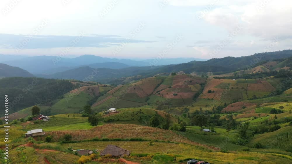 Aerial view morning scene of Pa Bong Piang paddy terraced rice fields with farm huts, Mae Chaem, Chiang Mai Thailand Aerial view morning scene of Pa Bong Piang paddy terraced rice fields with farm huts, Mae Chaem, Chiang Mai Thailand