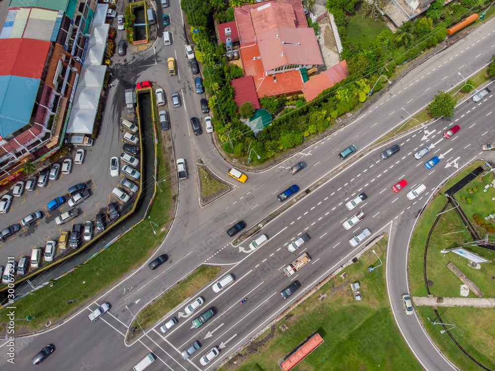 Aerial Drone image of car moving on surrounding Residential area at Kota Kinabalu, Sabah, Malaysia