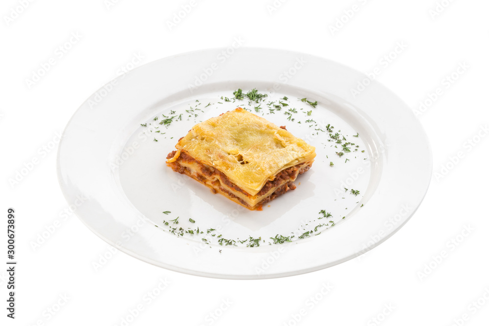 Piece of homemade Lasagne with beef isolated on white background