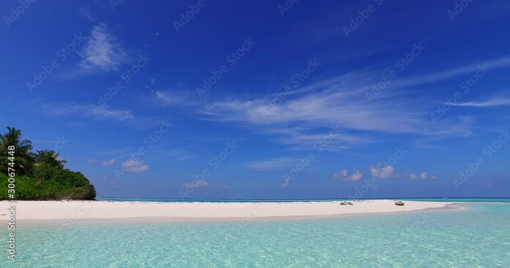 Stunning landscape of tropical paradise with big blue sky over white beach and vibrant turquoise lagoon in Bora bora island Stunning landscape of tropical paradise with big blue sky over white beach and vibrant turquoise lagoon in Bora bora island