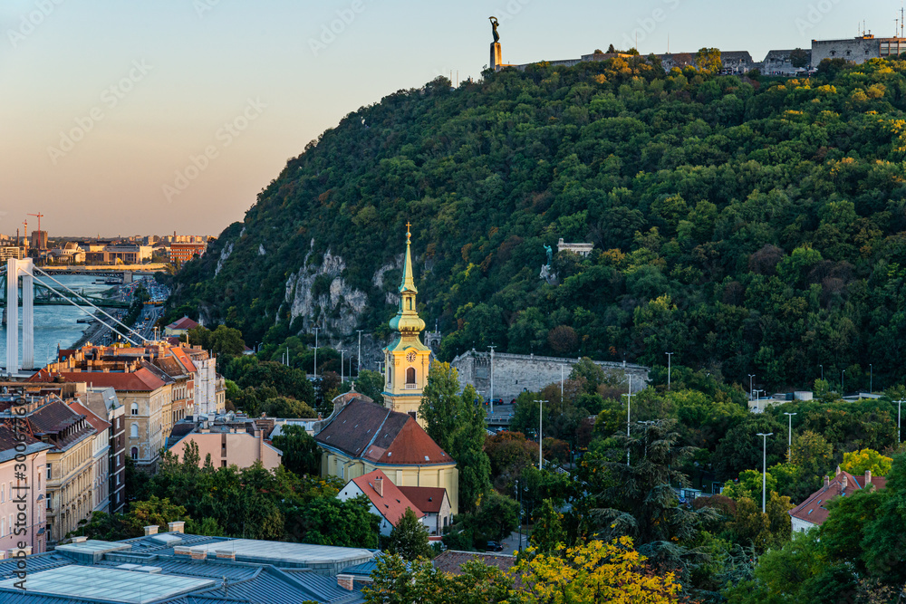 Fototapeta premium Budapest, Hungary - October 01, 2019: Saint Catherine of Alexandria Church and Gellert Hill in Budapest.