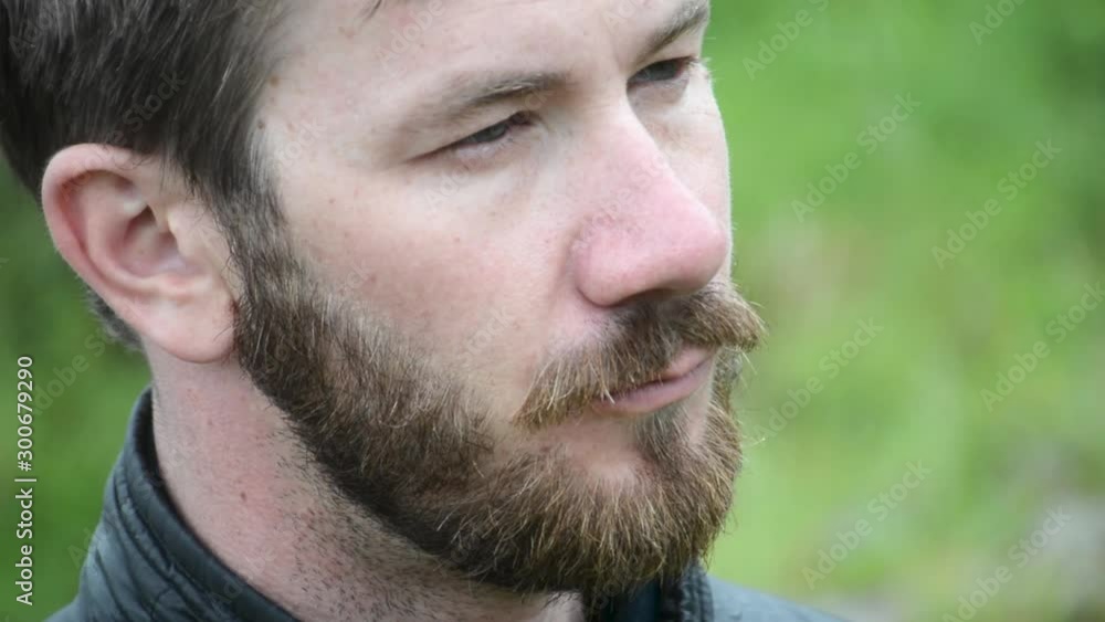 Serious Looking Middle Aged White Man With Beard Looking to the Right Extreme Close Up Serious Looking Middle Aged White Man With Beard Looking to the Right Extreme Close Up