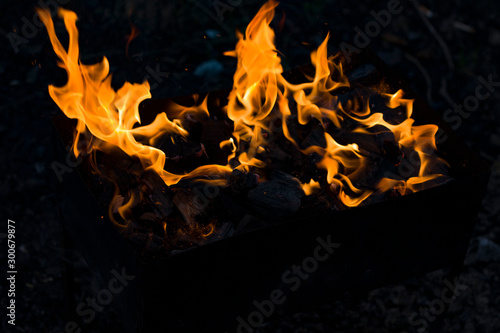 BURNING bright FIRE IN MANGAL blackened background