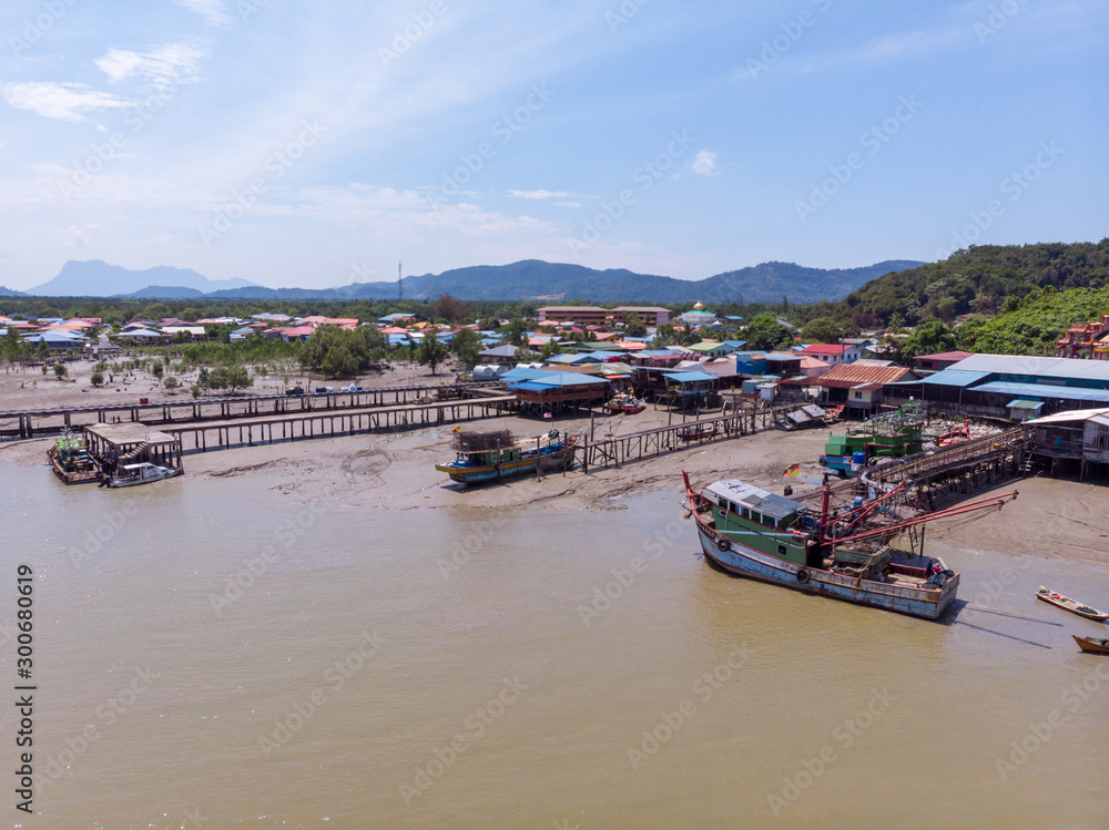 Aerial Drone view of beautiful rural landscape view with traditional wooden jetty at Muara Tebas, Kuching, Sarawak, Malaysia