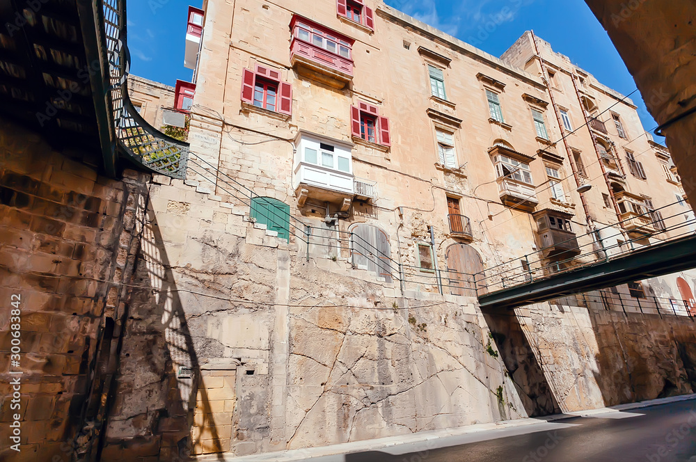 Bridges and old houses in perspective. Malta capital Valletta historical cityscape