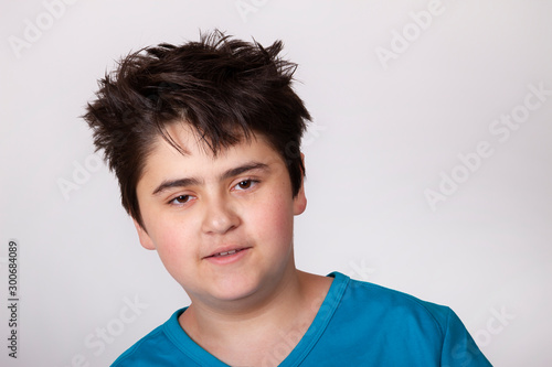 Cute teen boy with shaggy hair.