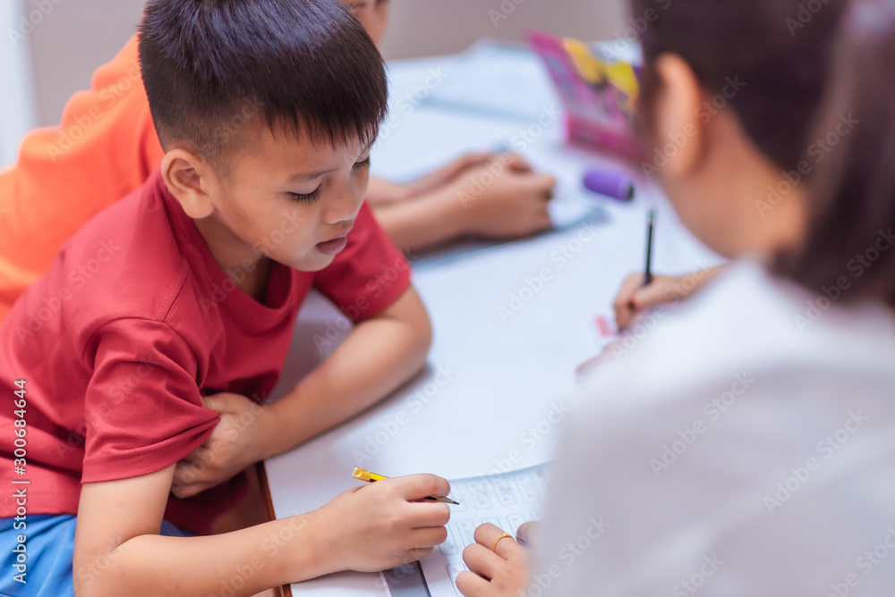 Asian elementary school children are studying in the classroom. Asian elementary school children are studying in the classroom.