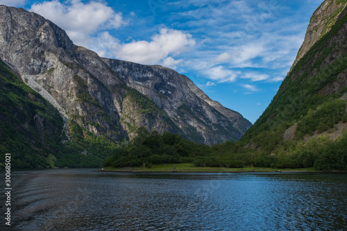 Mountains and Neroyfjord Sognefjord in Norway. Clouds and blue sky. July 2019 © Сергій Вовк