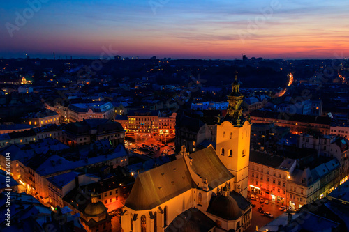 Aerial night view of illuminated Latin cathedral and Rynok square in Lviv, Ukraine. View from Lviv town hall © olyasolodenko