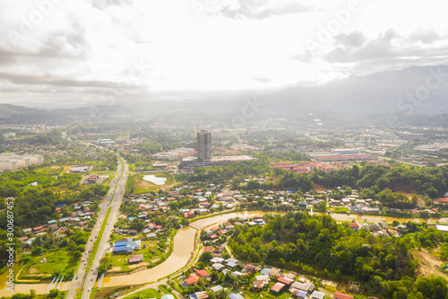 Aerial drone image of beautiful rural town local lifestyle houses residential of Menggatal Town, Sabah, Malaysia photo