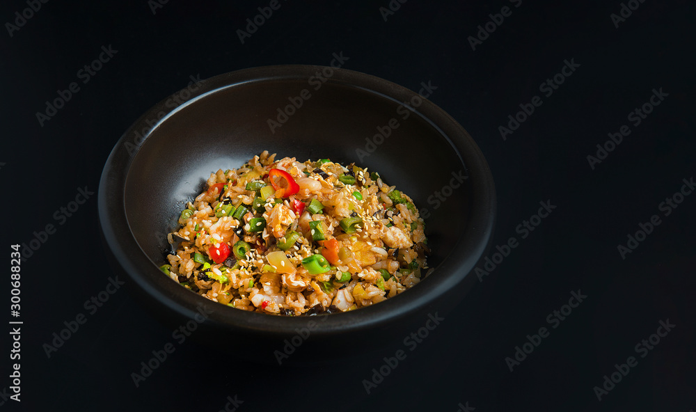 Asian rice in the black bowl with copy space Asian rice in the black bowl with copy space