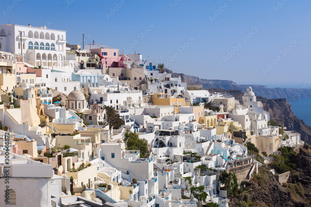 Houses and view from the city of Oia in Greece. Summer, season, travel, hotel, luxury concepts.