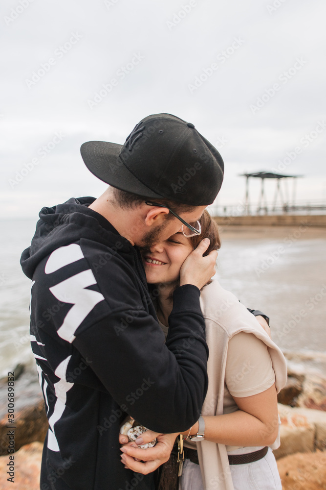 loving couple cuddling by the sea