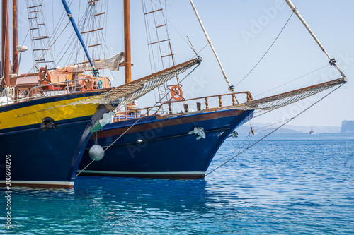 Sailboats in port in Santorini/Greece. Boating, yacht, ship, ships, marine, sea, ocean, akrotiri, thirasia, summer concept.