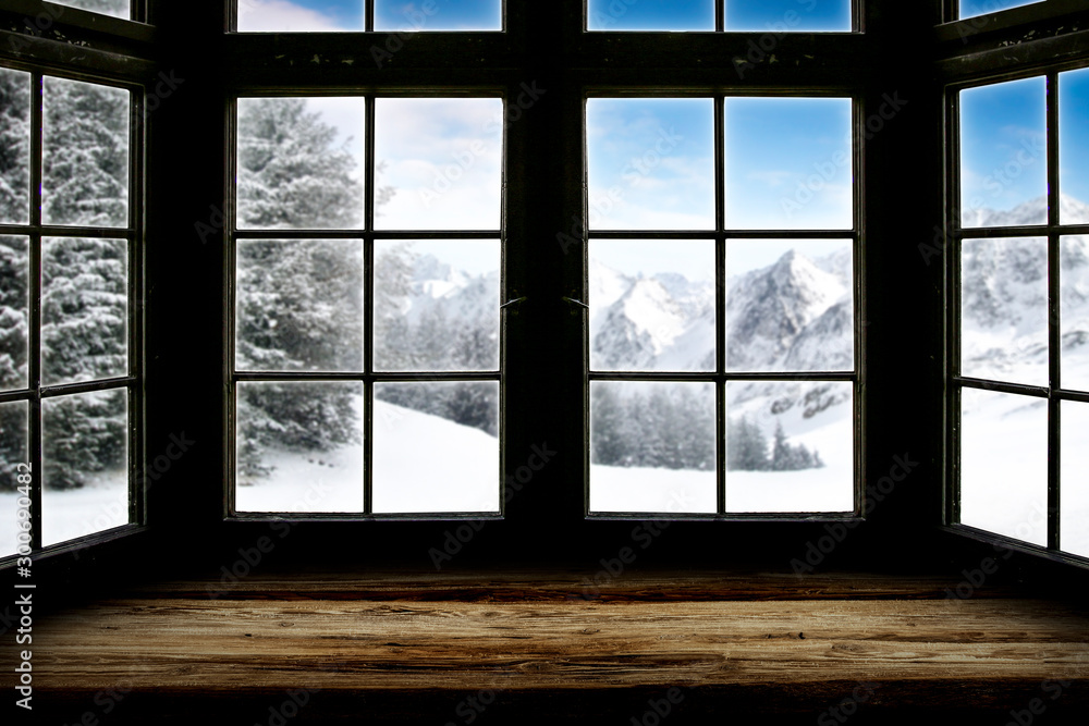 Table top with big window background and beautiful snowy winter landscape outside. Sunny winter day. Table top with big window background and beautiful snowy winter landscape outside. Sunny winter day.