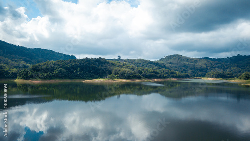 Mountain view with reflection on the lake, have cloudy sky in cinematic tone