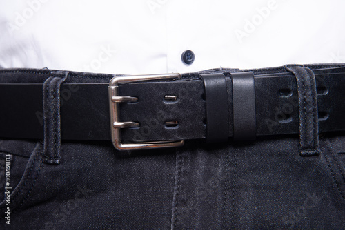 Black man jeans with leatherbelt and metal buckle