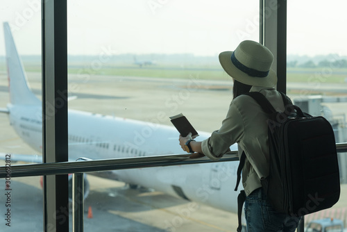 Wallpaper Mural woman standing and waiting in gate of airport Torontodigital.ca