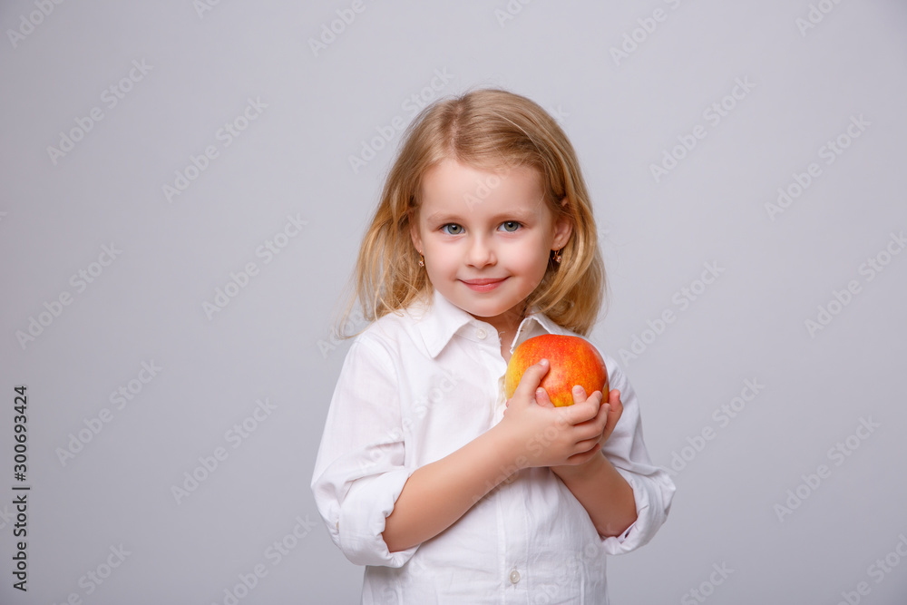baby girl with red Apple on white background baby girl with red Apple on white background