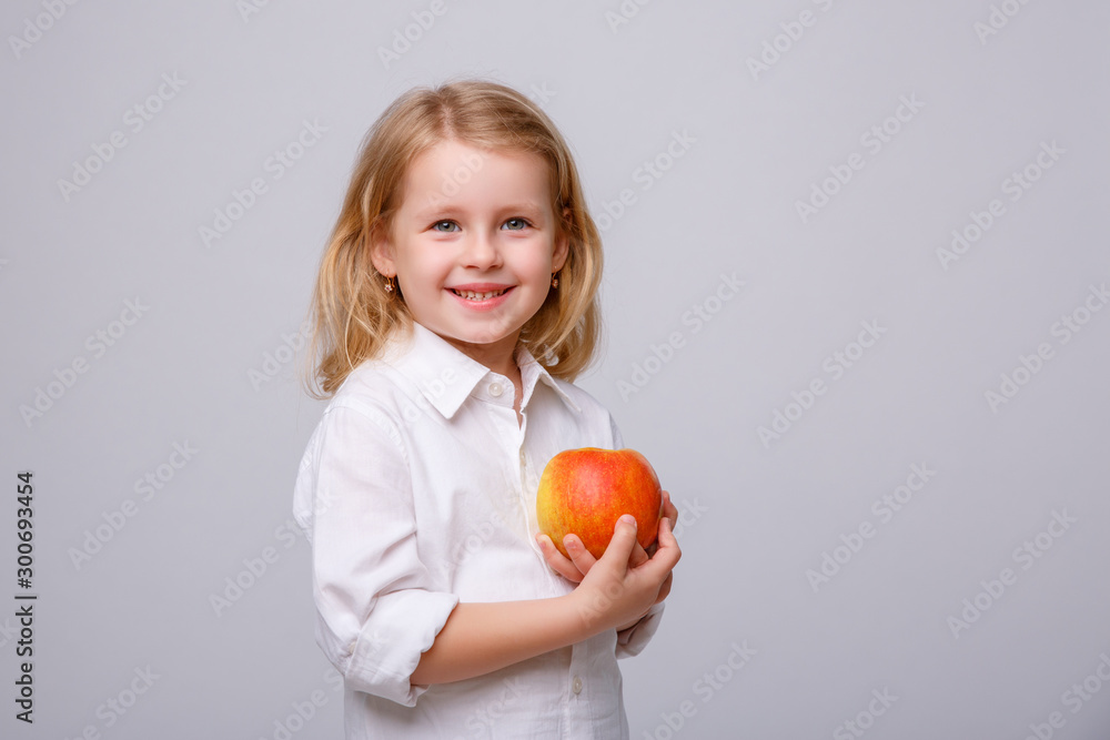 baby girl with red Apple on white background baby girl with red Apple on white background
