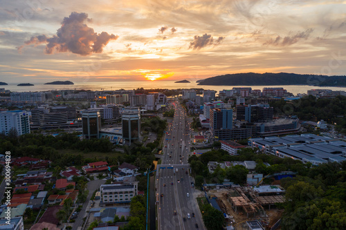 Kota Kinabalu, Sabah, Malaysia-September 28, 2019 : Aerial image of beautiful Kota Kinabalu City during beautiful twilight sunset on Sabah, Malaysia photo