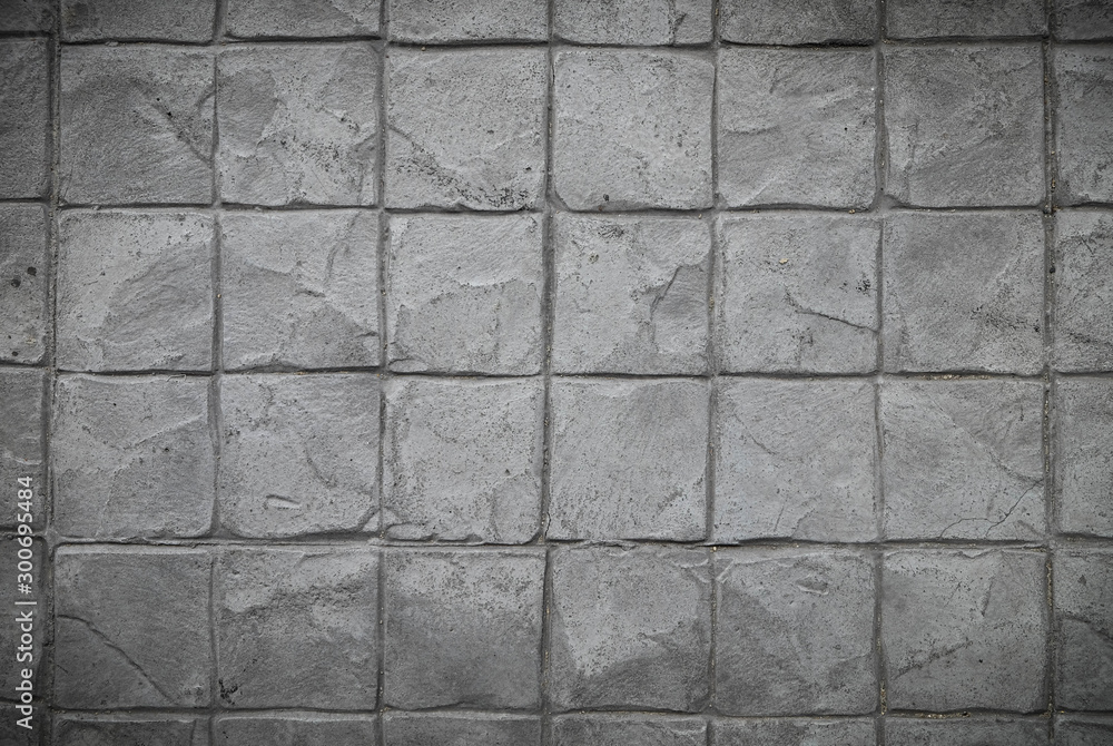 Naklejka premium Vignette Cement Stamp square Pattern grey tone, Rock wall, close up.Abstract Texture background. Grey Stone block pattern Great details, surface for any design.
