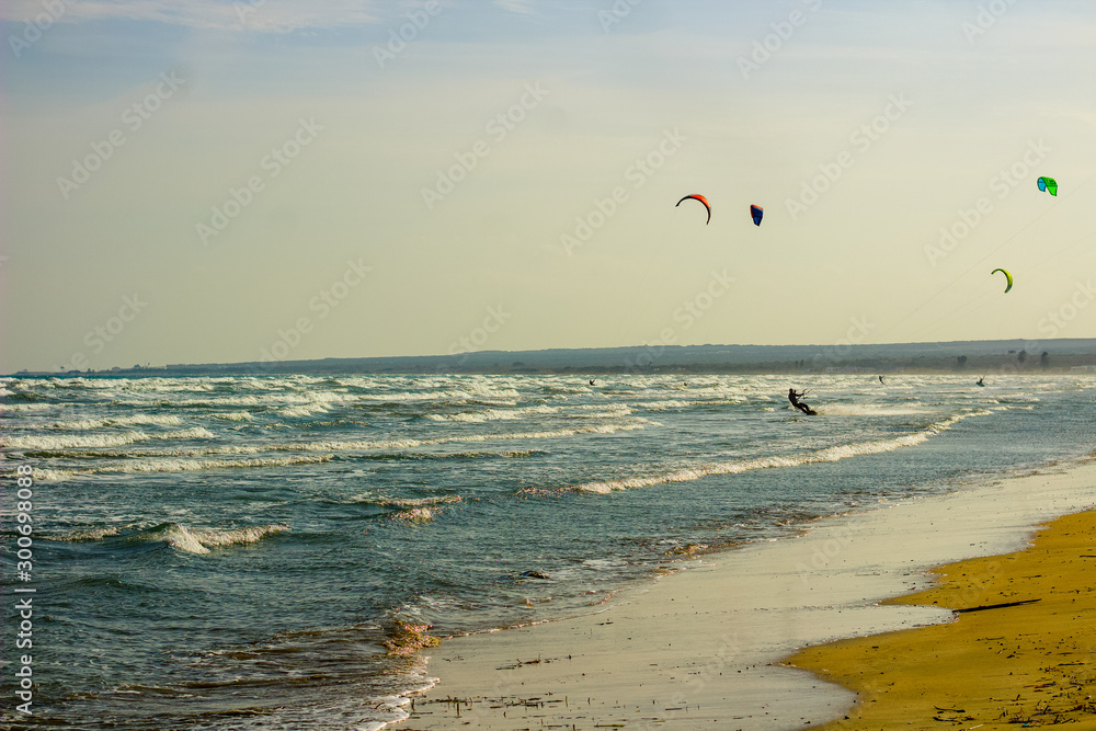 A group of  Kite Surfers on the coastal waves of Cyprus, Mediterranean Sea on this Extreme Sports day.