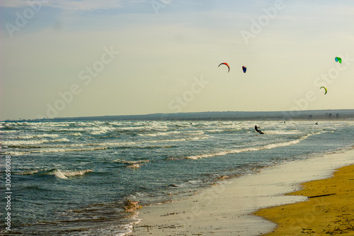 A group of  Kite Surfers on the coastal waves of Cyprus, Mediterranean Sea on this Extreme Sports day.