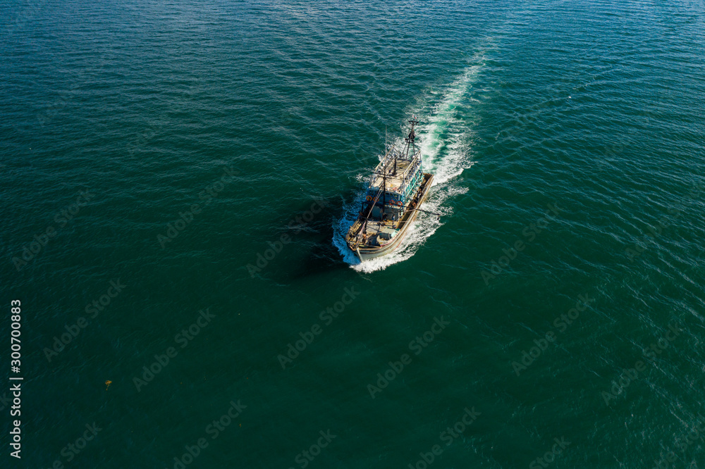 Obraz premium Aerial image of fisherman boat moving on open sea at Kudat, Sabah, Borneo