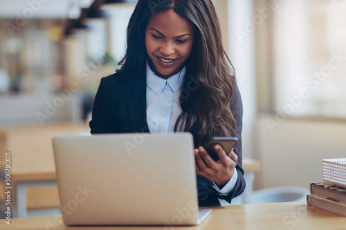 Smiling African American businesswoman busy working in an office
