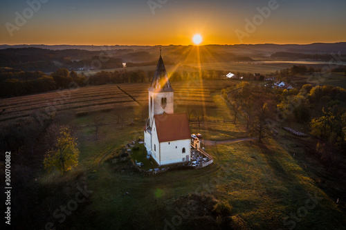 Church of St. James in Chvojno dates from the 13th century. It is situated on a hill above the Baroque farmyard Chvojen in the cadastral area of the town Benesov near by Prague. photo