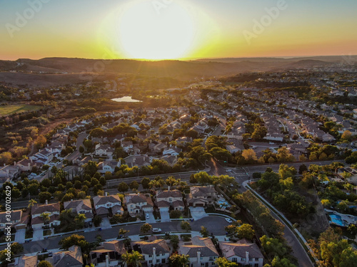 Aerial view of residential modern subdivision luxury house neighborhood during sunset. South California, USA