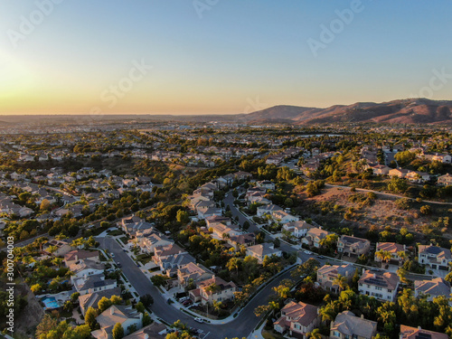 Aerial view of residential modern subdivision luxury house neighborhood during sunset. South California, USA