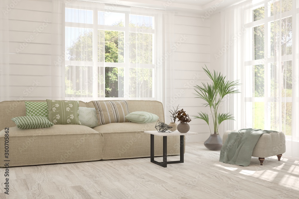 Fototapeta premium Stylish room in white color with sofa and summer landscape in window. Scandinavian interior design. 3D illustration
