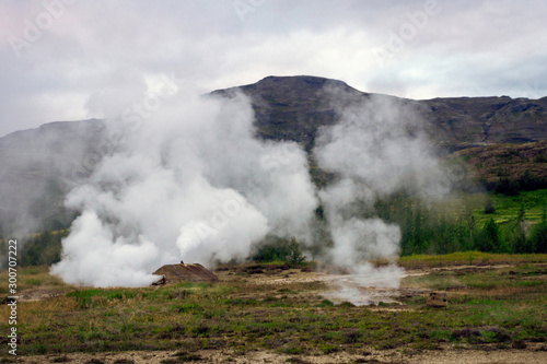 Smoke at geothermal area, blue hour in Haukadalur in Iceland. Strokkur and nature concept. © Jon Anders Wiken