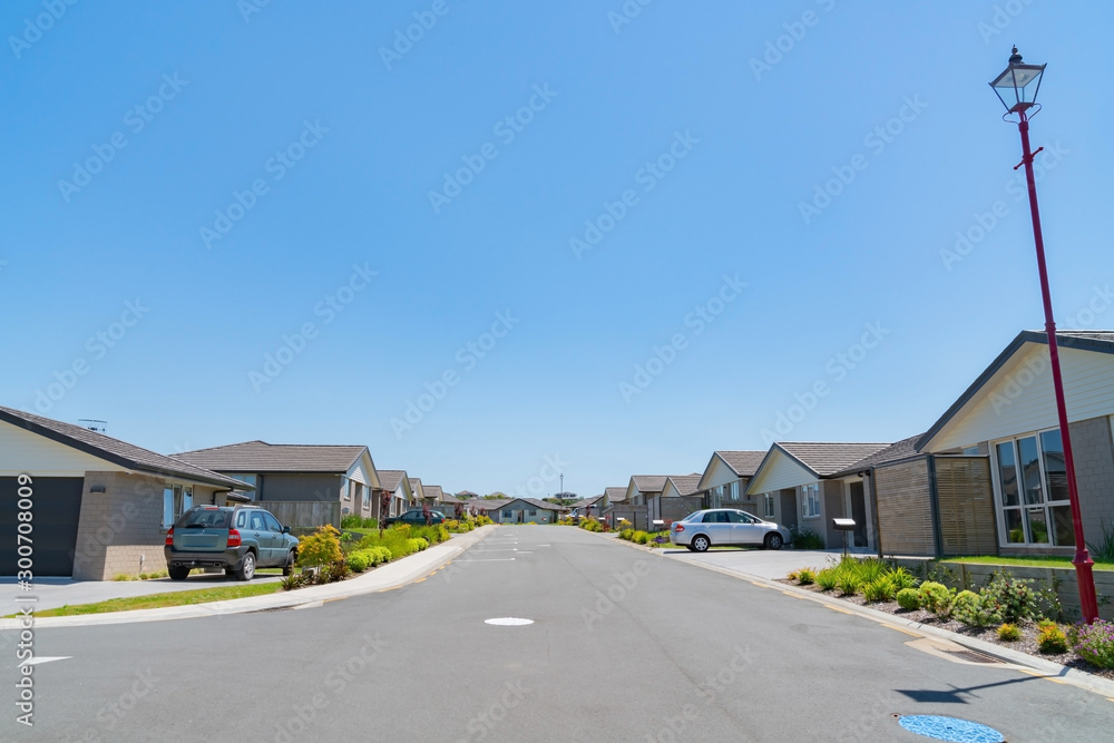 New subdivision street with uniform homes.