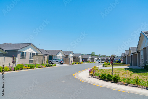 Fotografie New subdivision street with uniform homes.