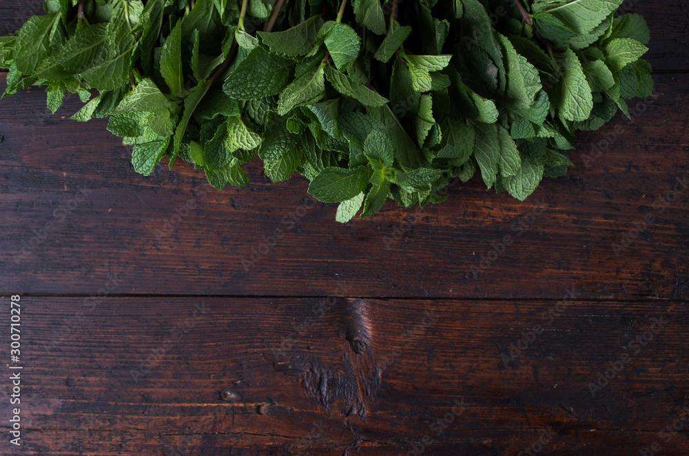 Fresh mint on rustic wooden background Fresh mint on rustic wooden background