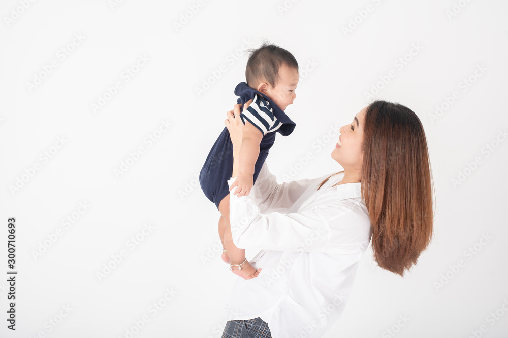 Happy newborn cute baby and beautiful mom in studio Happy newborn cute baby and beautiful mom in studio