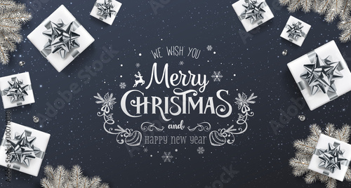 Merry Christmas and New Year Text on dark background with gift boxes, fir branches, silver bows, ribbons, decoration, sparkles, confetti, bokeh. Xmas holiday, realistic vector, top view