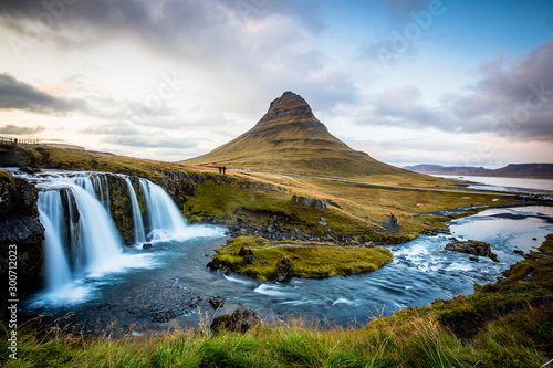 The picturesque sunset over landscapes and waterfalls. Kirkjufell mountain  Iceland