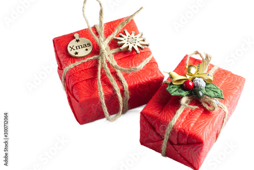 Christmas composition. Red Gifts box, wooden Christmas decorations on white background. Christmas, winter, new year concept. Flat lay, top view, copy spac