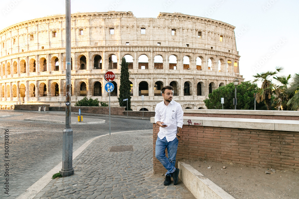 Man standing watching the Colosseum