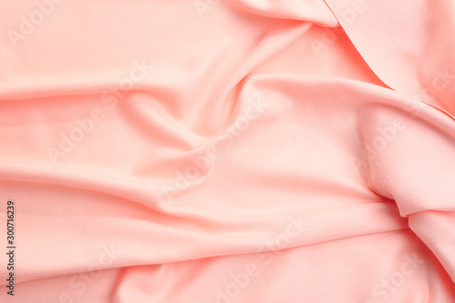 Elegant peach cloth as background, closeup view
