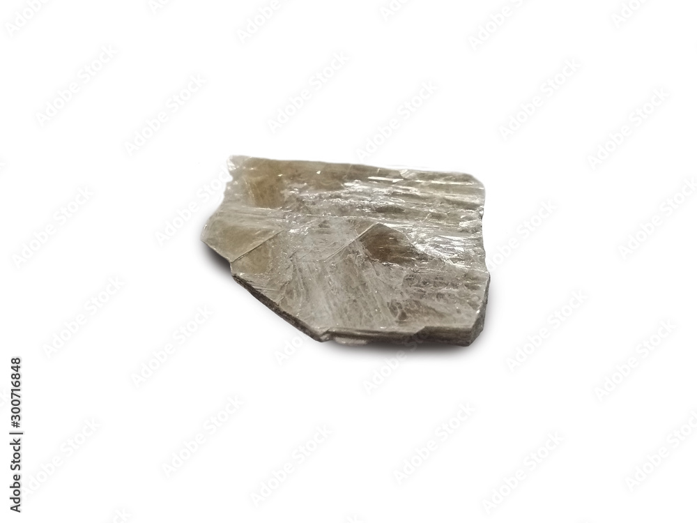 Muscovite isolated on white background. also known as common mica, isinglass, or potash mica. There is noise and grain caused by the texture of the stone. Muscovite isolated on white background. also known as common mica, isinglass, or potash mica. There is noise and grain caused by the texture of the stone.